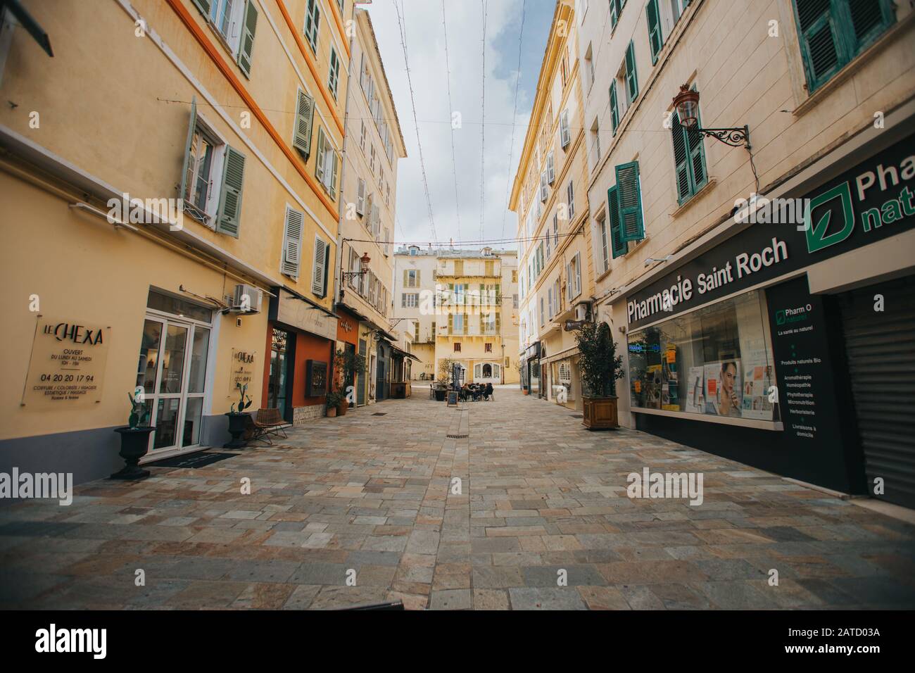 Set of low floor buildings surrounding a narrow path Stock Photo - Alamy