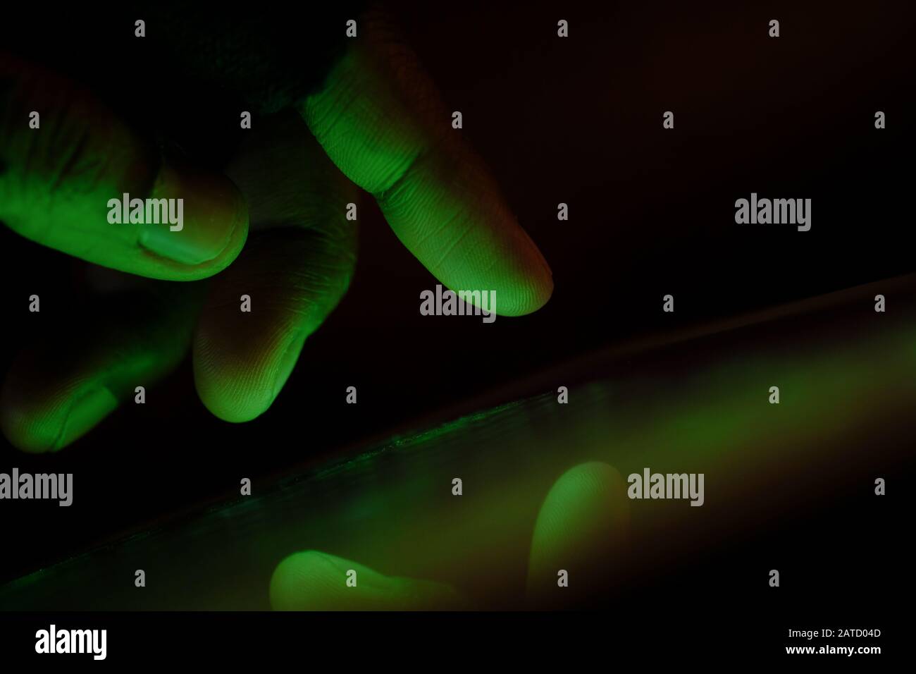Close up of hacker hand steeling data Stock Photo