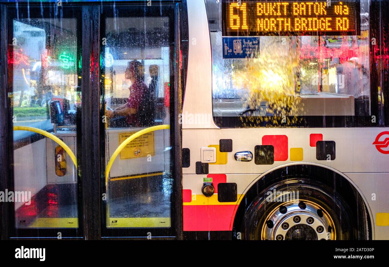 Singapore-29 JAN 2020:Singapore public bus in bus stop in rain day Stock Photo