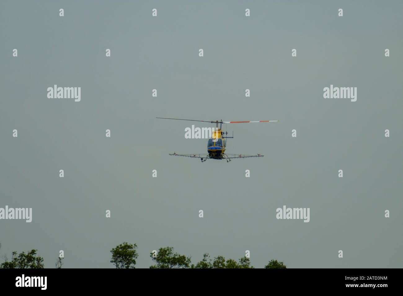 Mosquito Control Helicopter over the Tinchi Tanba Wetlands Stock Photo