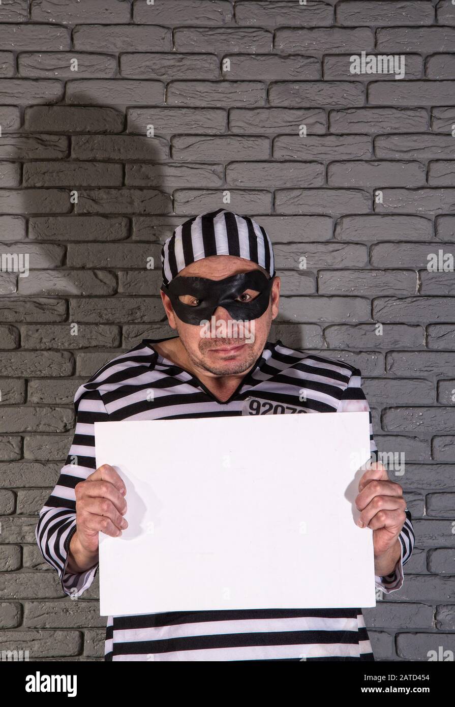Prisoner holds a tablet Stock Photo