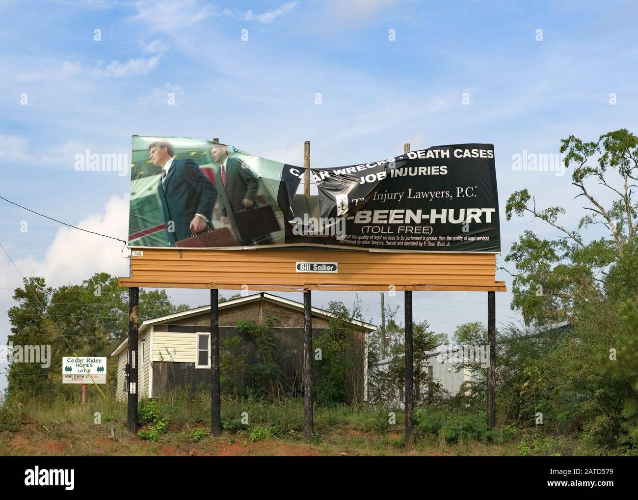 Irony. A damaged injury lawyer billboard advertisement along the side
