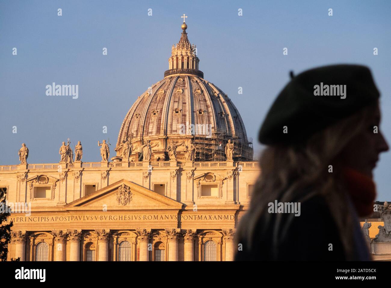 Rome, Italy - Jan 3, 2020: silhouette of a female tourist near the St. Peters Basilica  Vatican City, UNESCO World Heritage Site, Rome, Lazio, Italy, Stock Photo