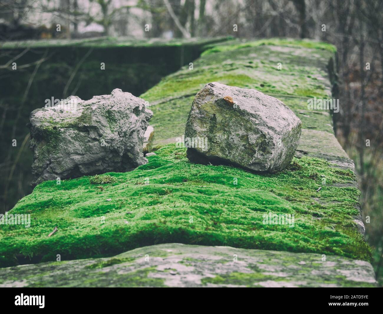 Two small stones on a wall Stock Photo - Alamy
