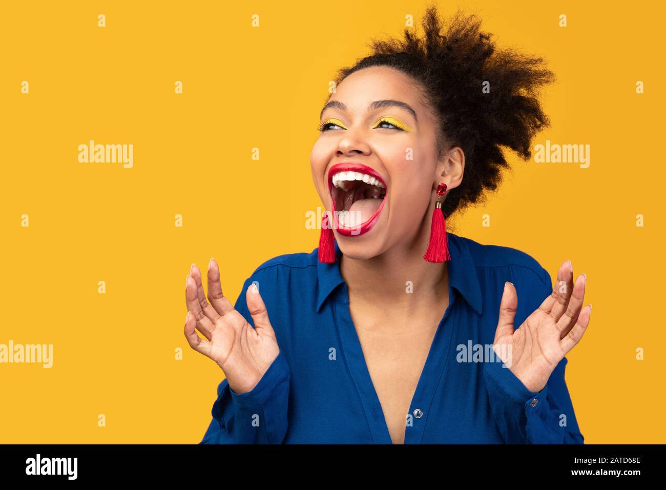 Happy afro woman screaming and raising hands Stock Photo - Alamy