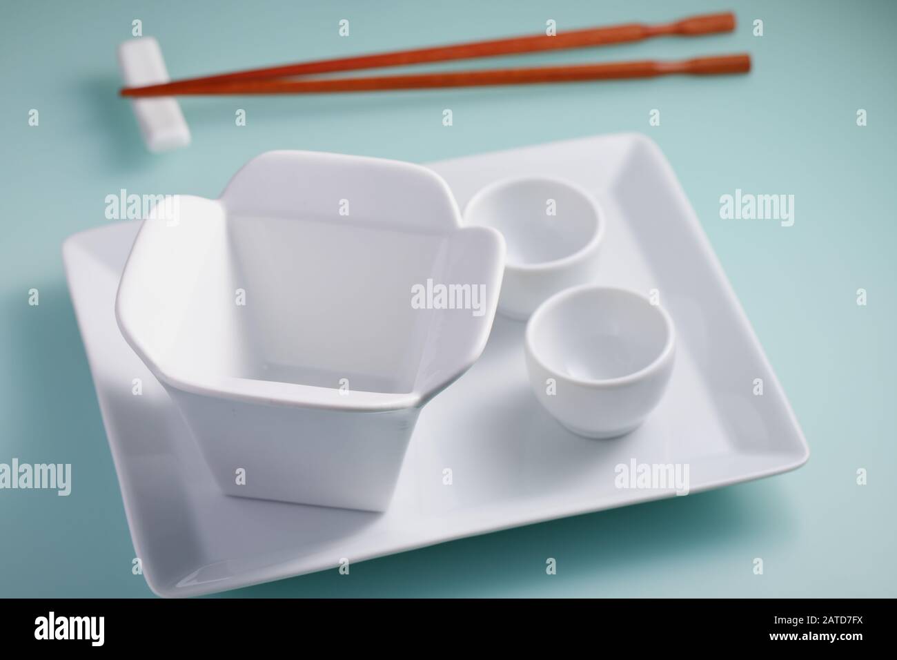 Asian table setting on blue background Stock Photo