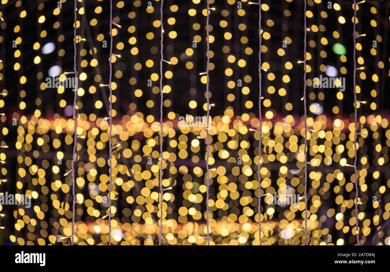 string of light bulbs on yellow abstract background Stock Photo - Alamy