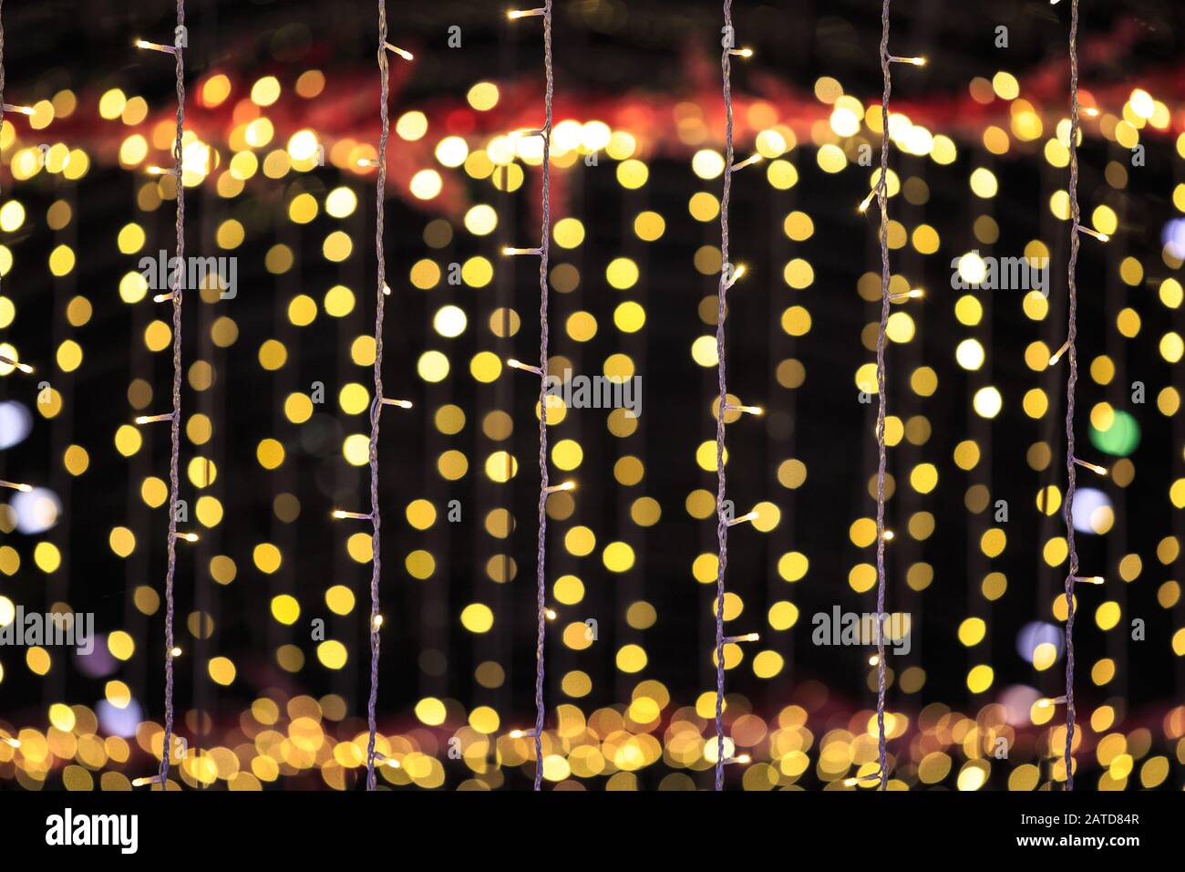 string of light bulbs on yellow abstract background Stock Photo