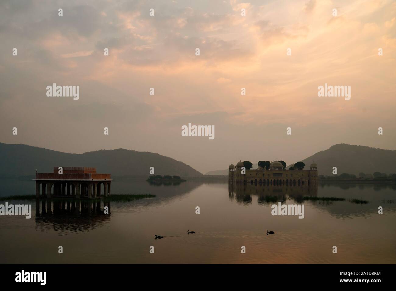 Empty Royal palace surrounded by lake and Aravalli hills as dawn breaks in Jaipur, Rajasthan, India. Stock Photo