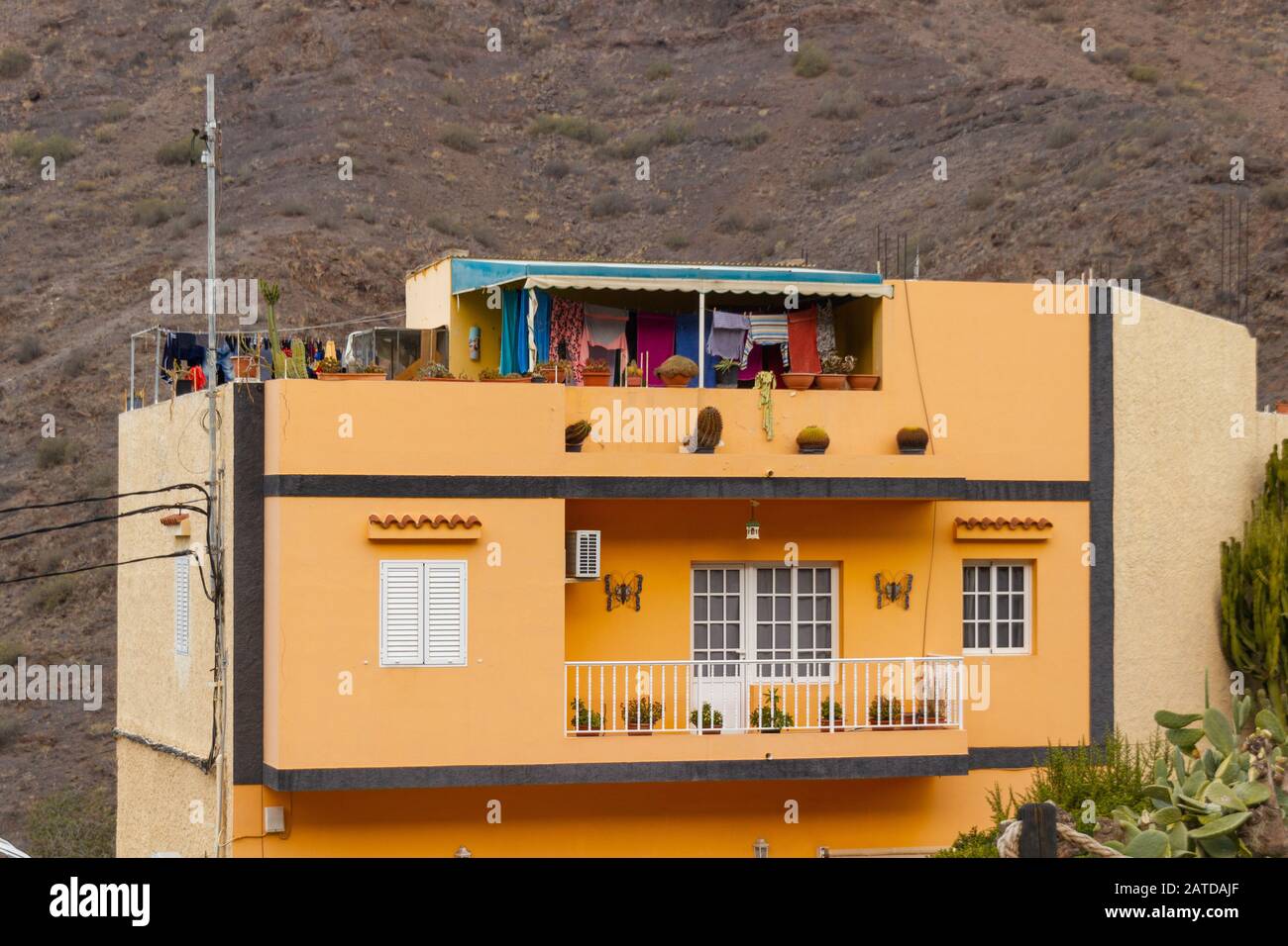 Typical yellow house with balcony on Gran Canaria Stock Photo