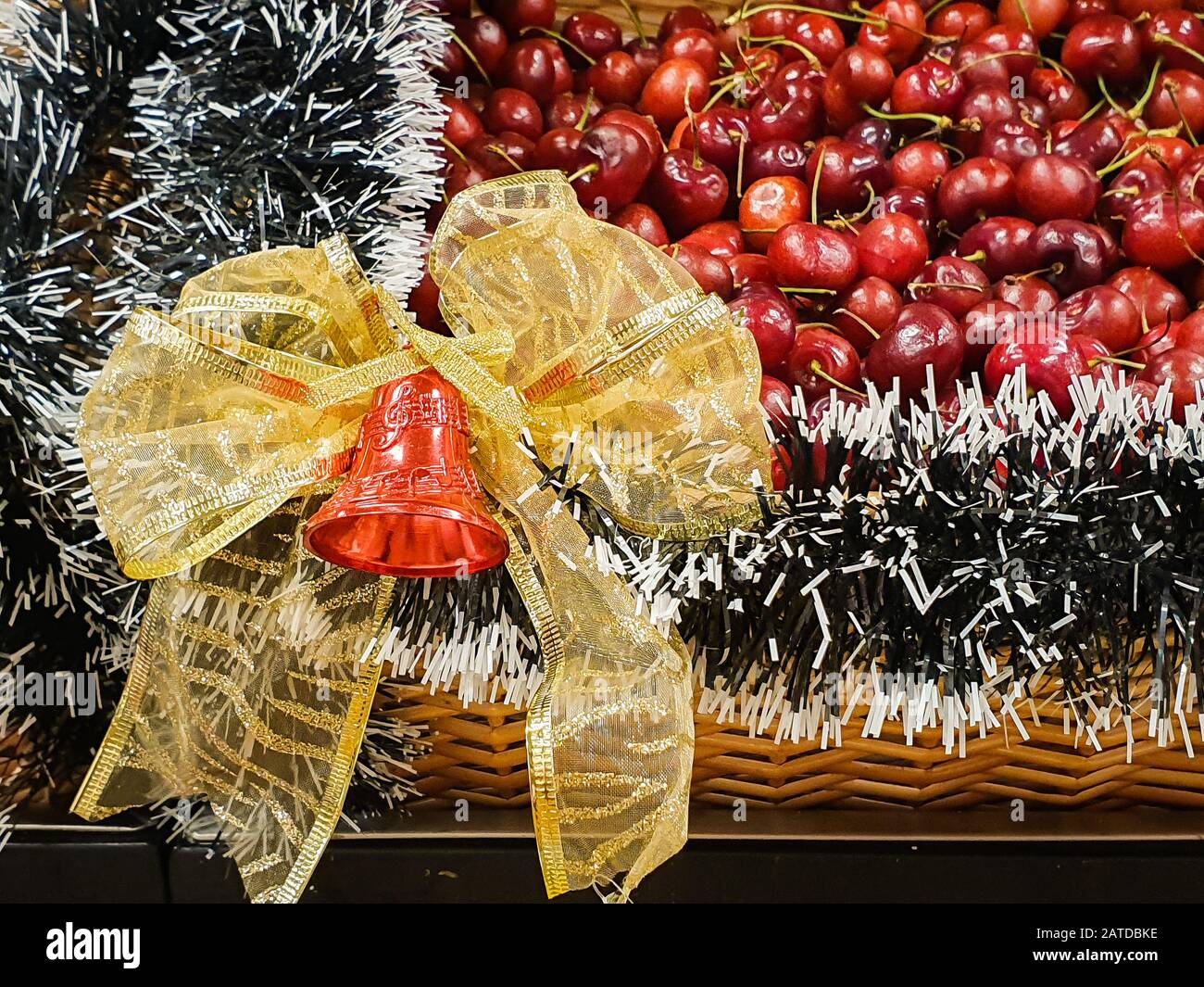 Fresh cherries in a Christmas basket Stock Photo