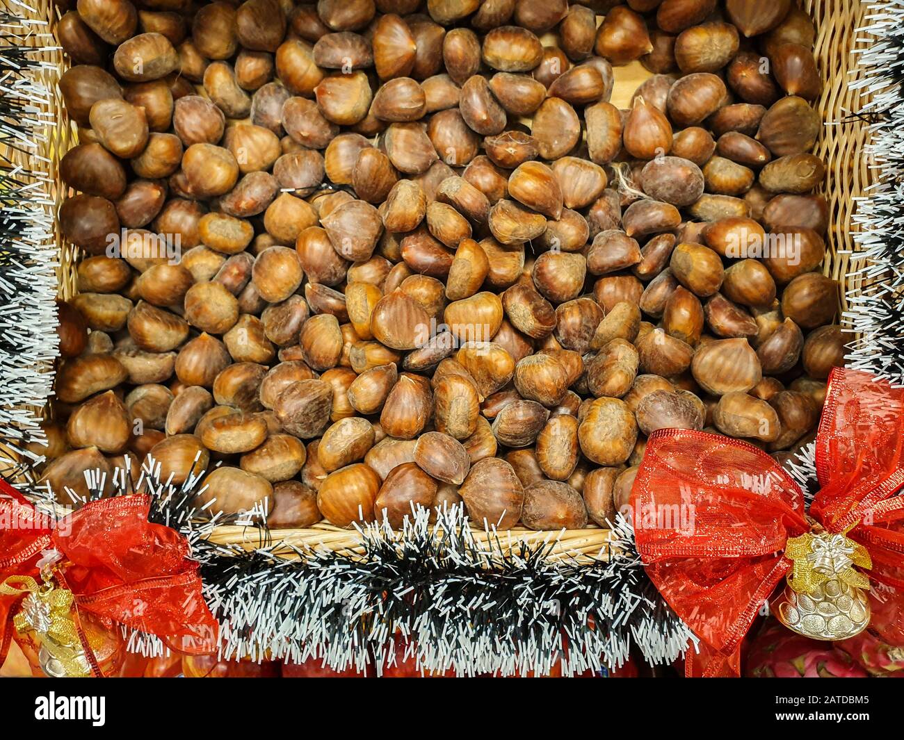 Chestnuts in a Christmas basket Stock Photo