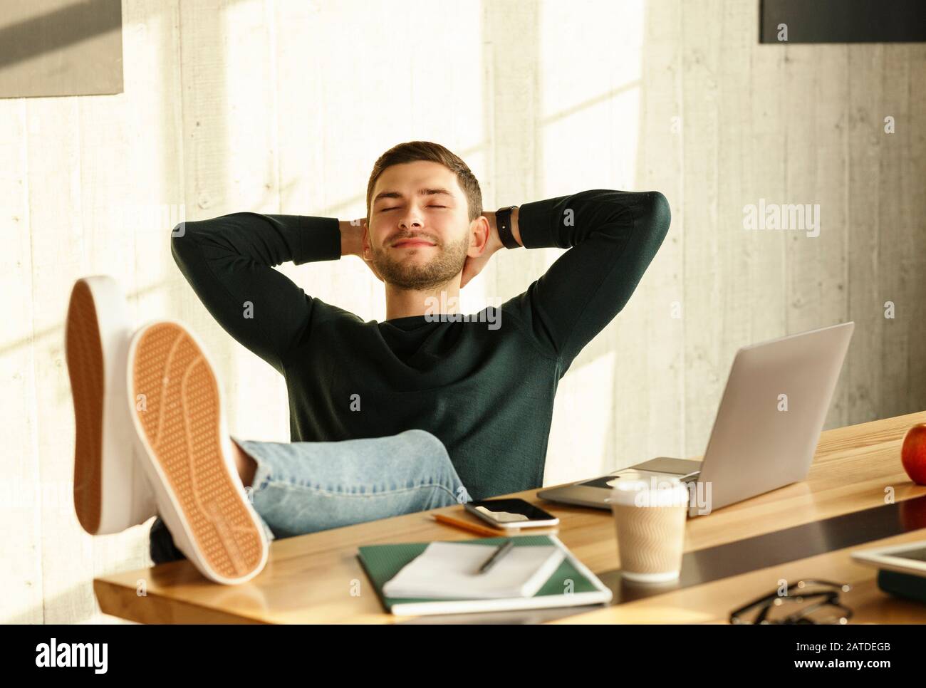 Office Manager Relaxing Sitting With Legs On Workdesk Indoor Stock Photo Alamy