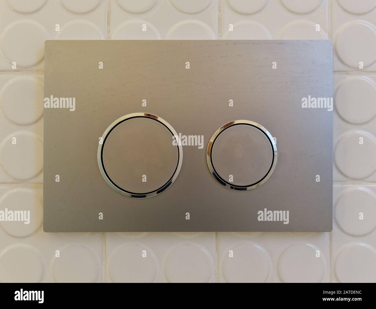 Modern Dual button for flushing in the bathroom Stock Photo Alamy
