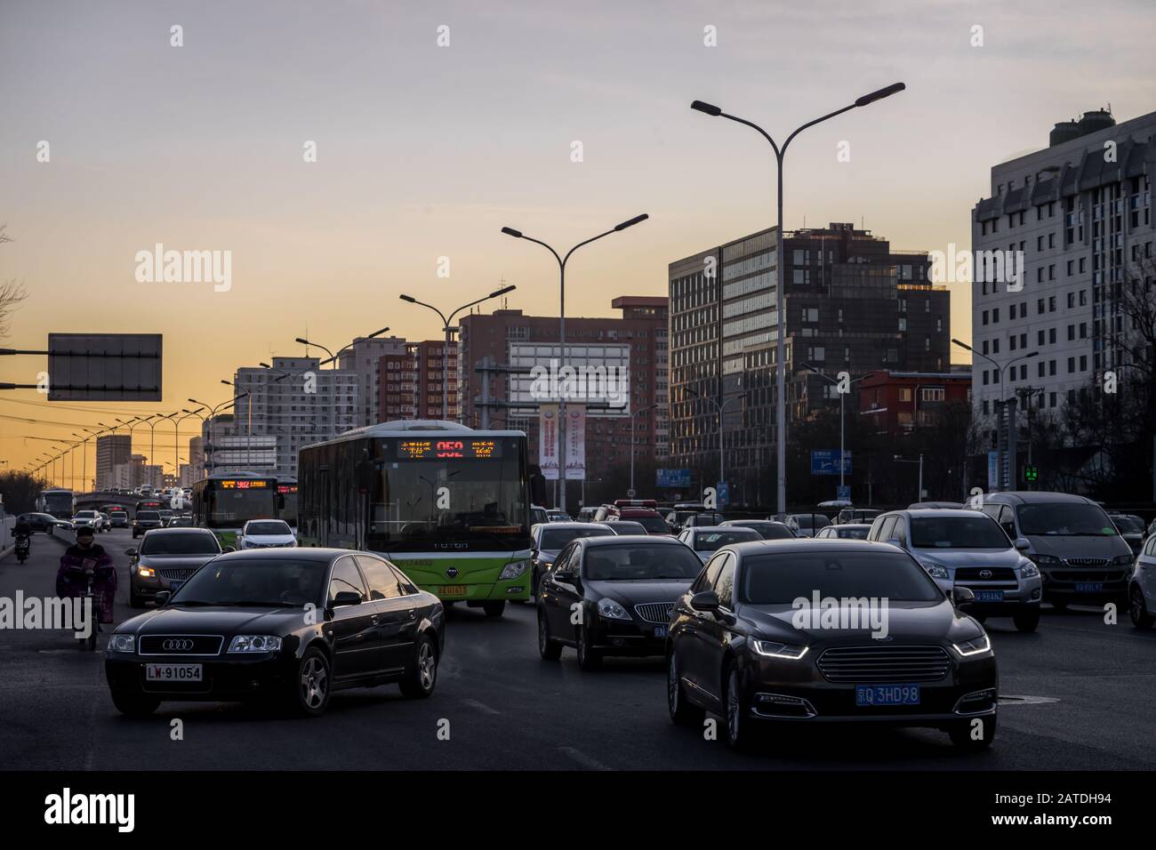 Beijing, China - December 28 2018: Deep view of a heavy traffic jam in Beijing, a smog covered city, when the smog alert went to orange, 'hazardous'. Stock Photo