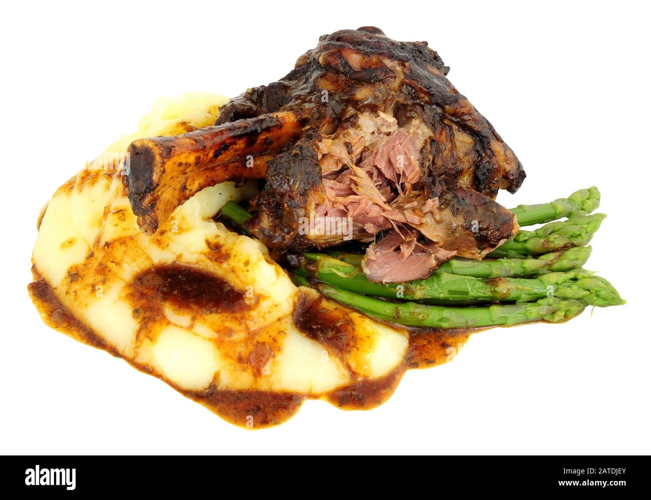 Slow cooked lamb shank meal with creamy mashed potato and asparagus