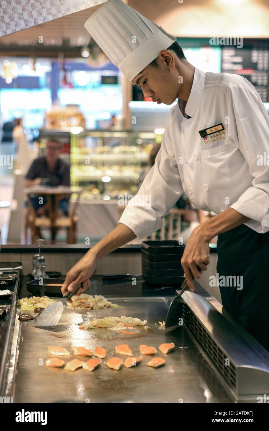 Thailand, Phuket, Patong. January 3, 2020: Chef y prepares Japanese dishes on the Tepanyaki roasting surface in a Japanese restaurant Stock Photo