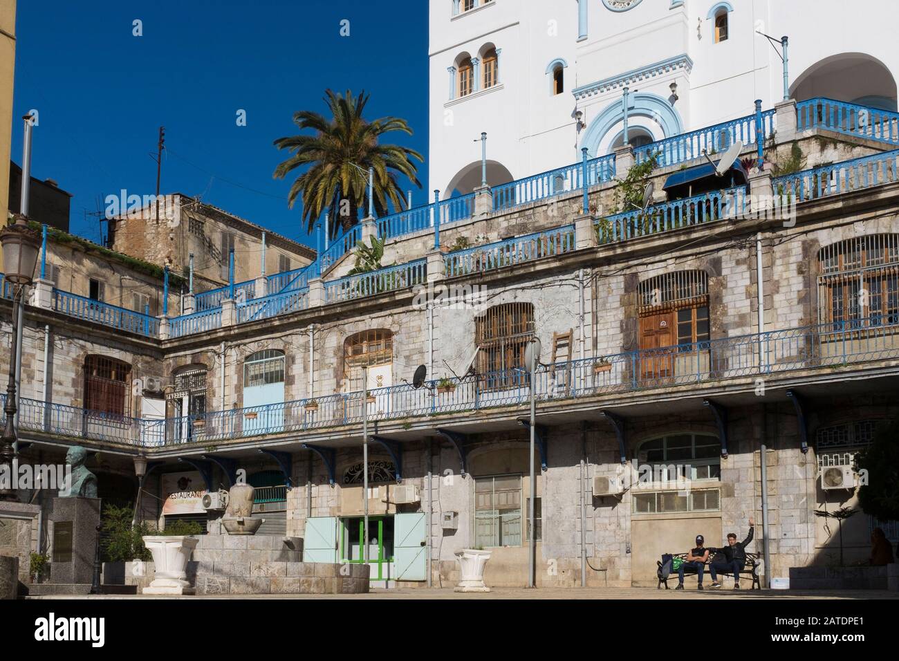 French architecture has left its blue shutters and town squares in Bejaia, a port city on the northern coast of Algeria on the Mediterranean sea. Stock Photo