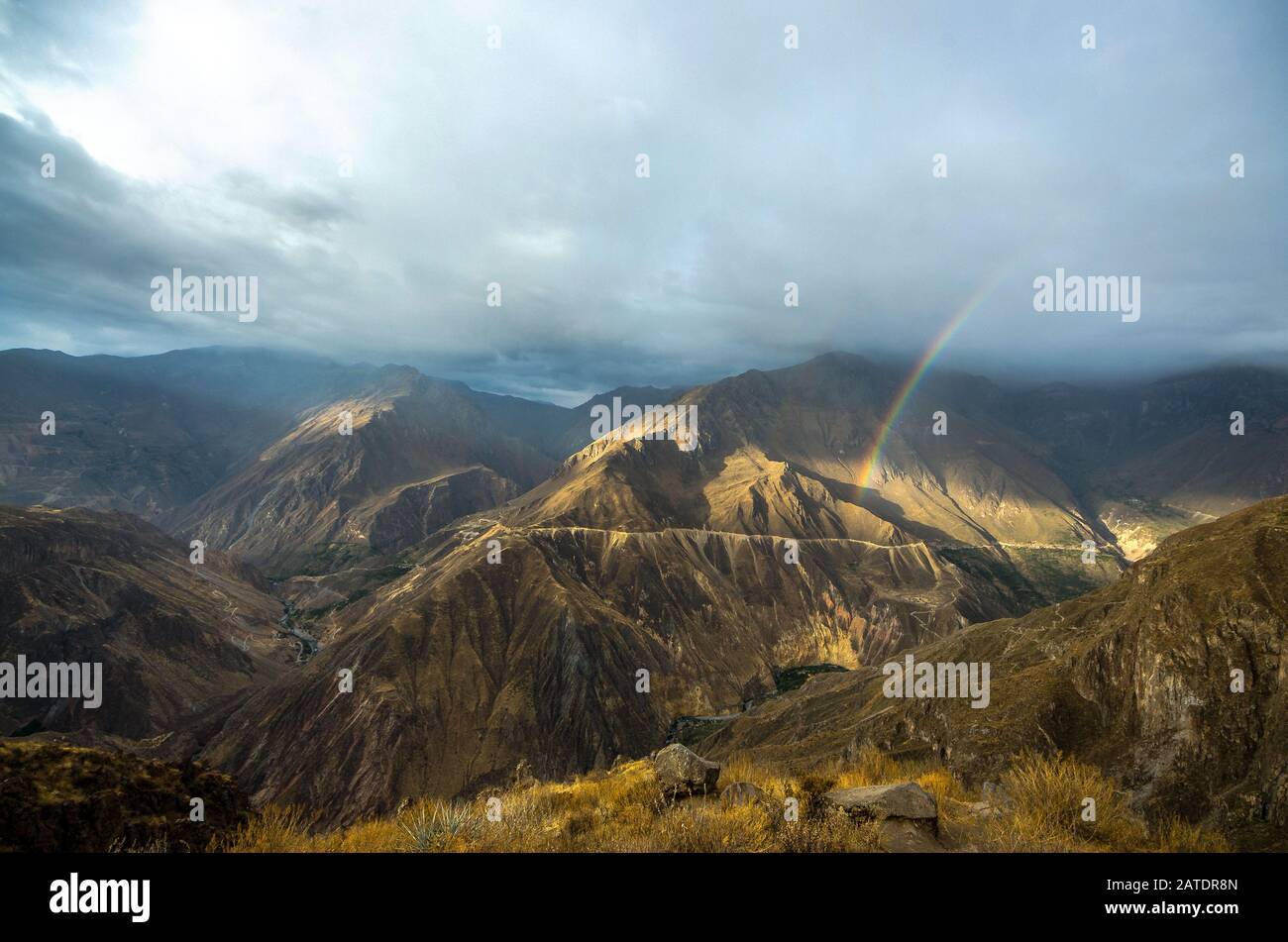 The canyon Colca with rainbow - is the deepest in the world. Colca Peru ...