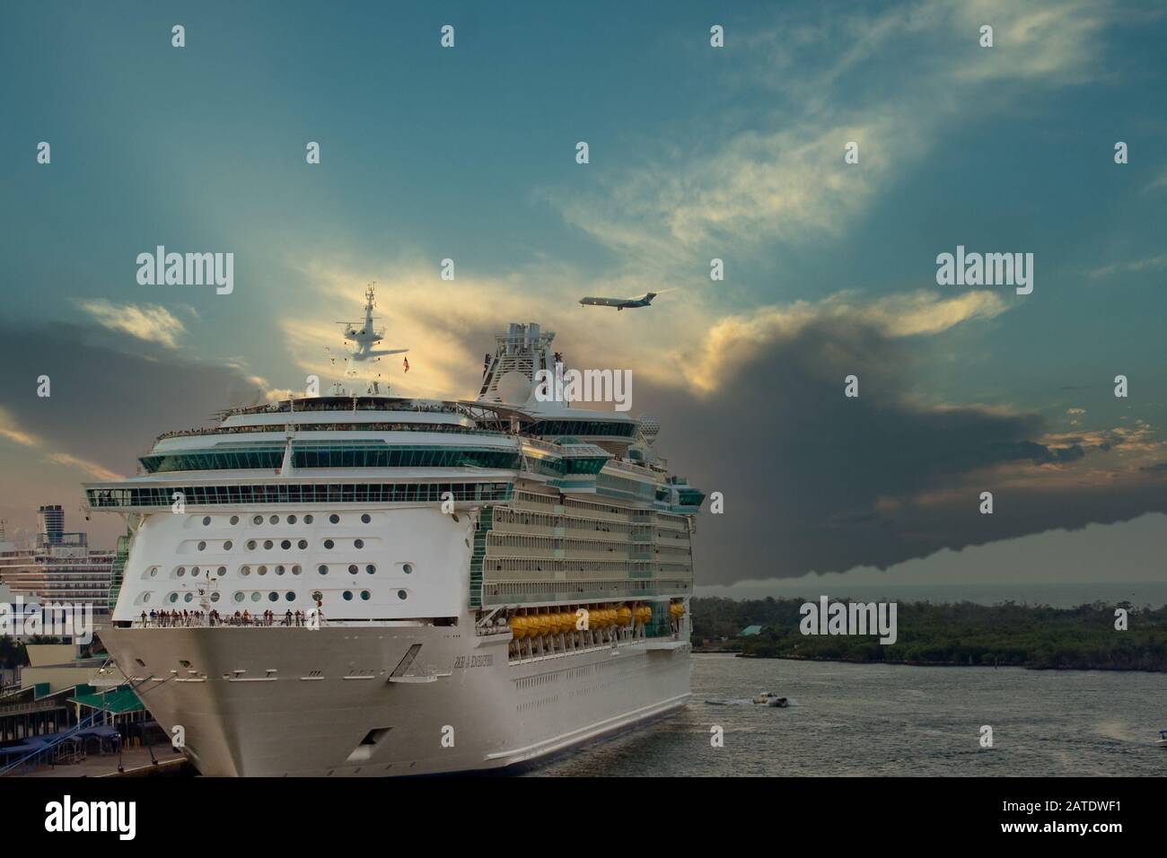 Cruise Ship and Plane at Dusk Stock Photo - Alamy