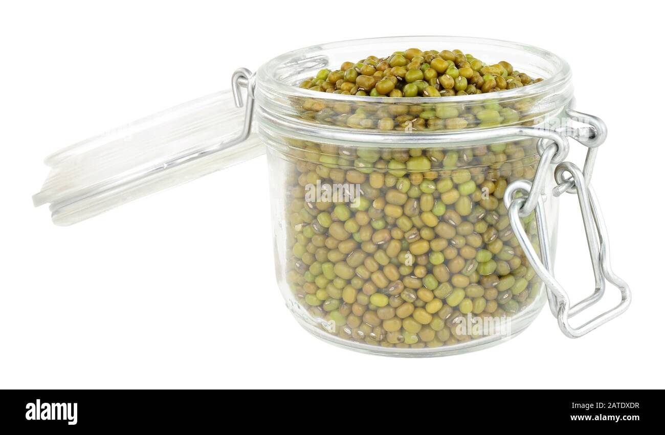 Glass food storage jars filled with green lentils isolated on a white background Stock Photo Alamy