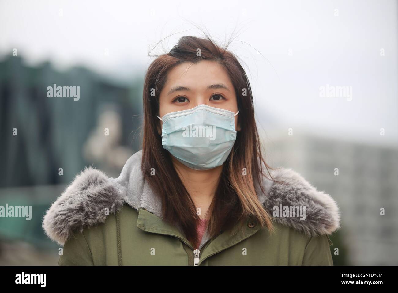masked girl to protect herself from wuhan virus in public area Stock ...
