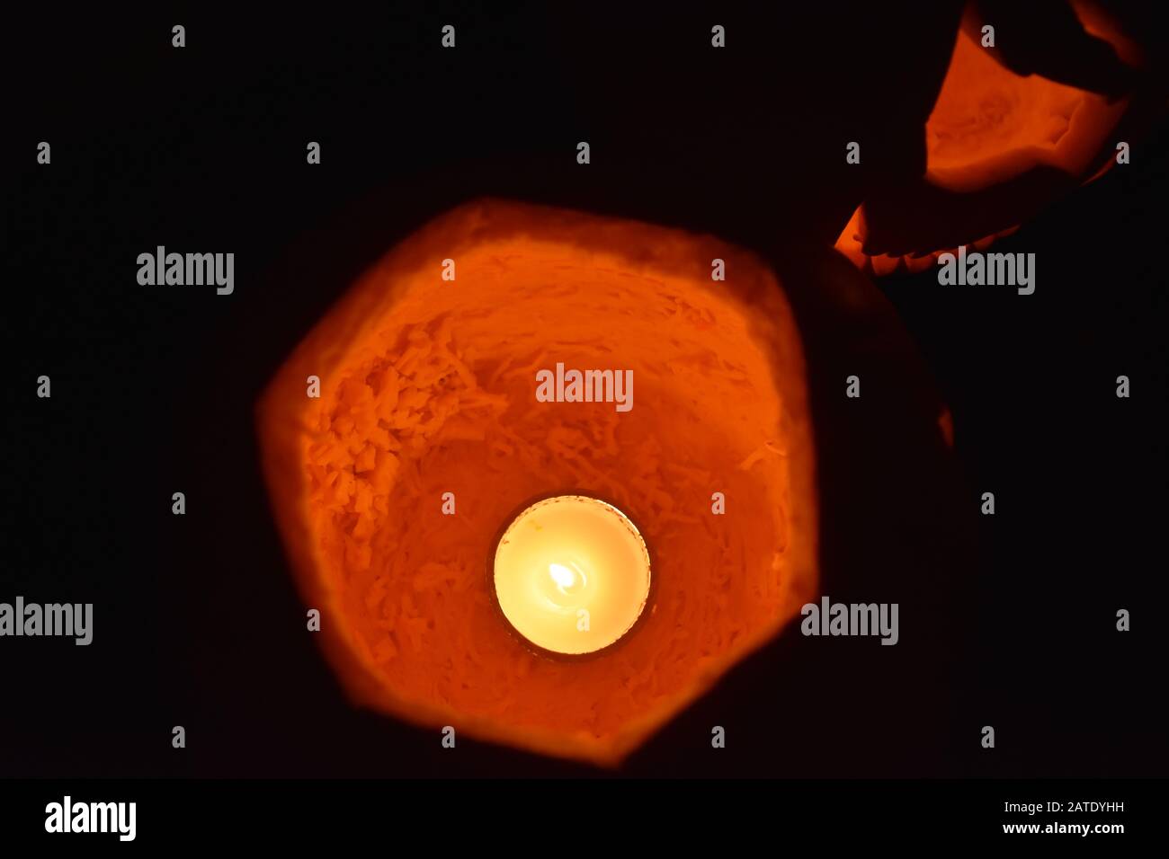 Candle inside jack-o'-lantern Stock Photo
