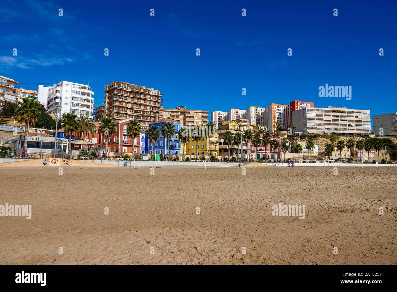 Beach, Colourful apartment tower blocks and Winter sun at Villajoyosa