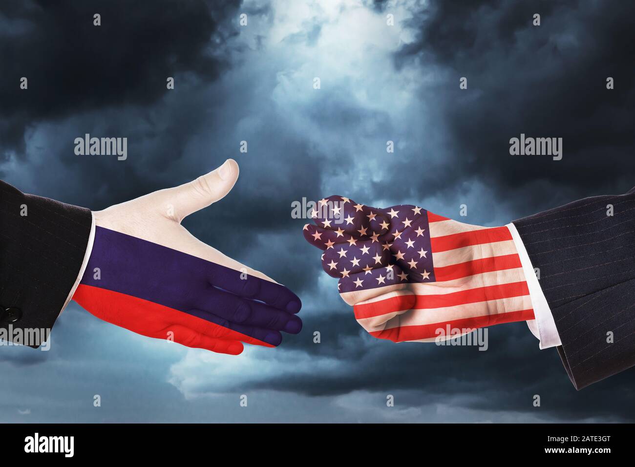 Hands on sky background. Concept on the topic of the proposal of friendship and relations between Russia and America Stock Photo