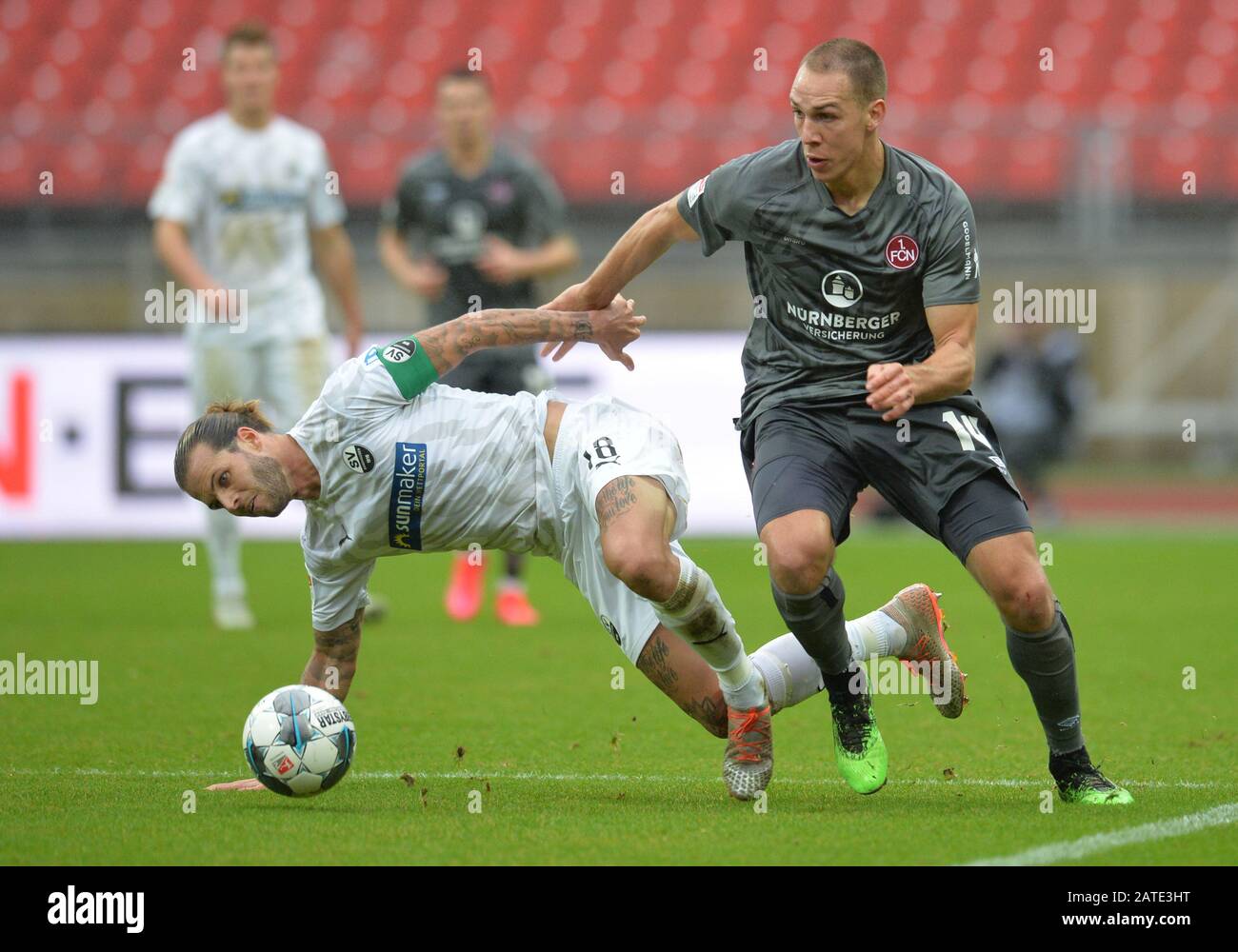 Nuremberg, Germany. 02nd Feb, 2020. Football: 2nd Bundesliga, 1st FC Nürnberg - SV Sandhausen, 20th matchday at the Max Morlock Stadium. Michael Frey from Nuremberg plays against Dennis Diekmeier (l) from Sandhausen. Credit: Timm Schamberger/dpa - IMPORTANT NOTE: In accordance with the regulations of the DFL Deutsche Fußball Liga and the DFB Deutscher Fußball-Bund, it is prohibited to exploit or have exploited in the stadium and/or from the game taken photographs in the form of sequence images and/or video-like photo series./dpa/Alamy Live News Stock Photo
