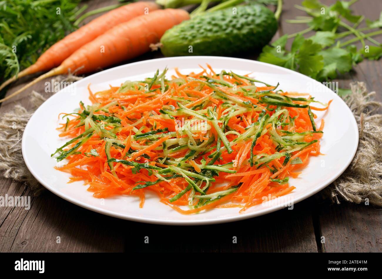 Vegetables salad with carrot and cucumber on white plate Stock Photo