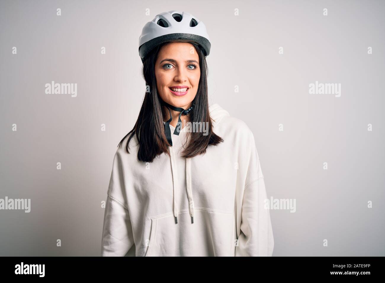 Woman on bicycle wearing white helmet hi res stock photography and images Alamy