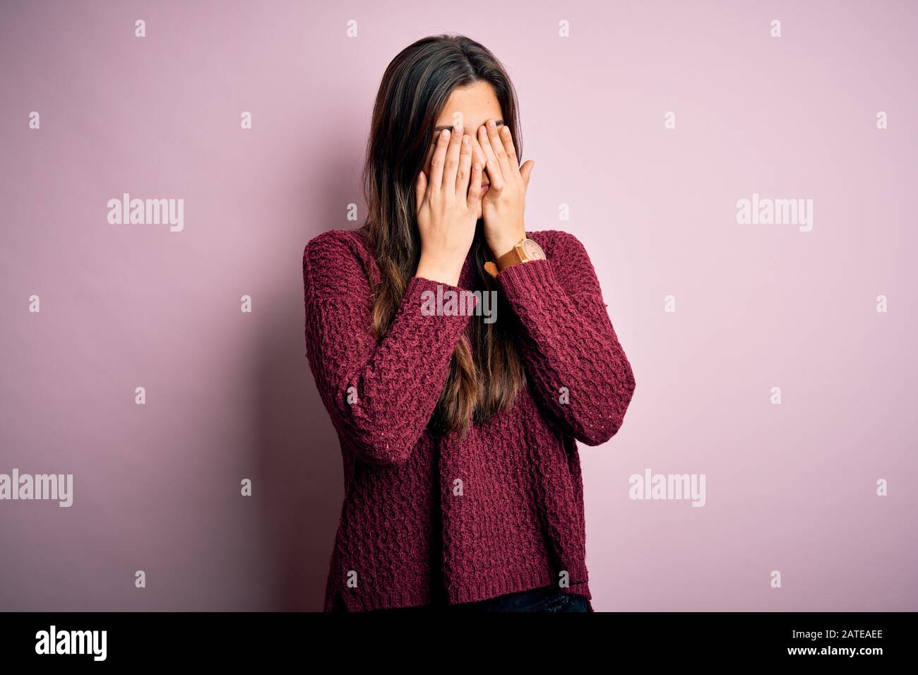 Young beautiful girl wearing casual sweater over isolated pink background rubbing eyes for fatigue and headache, sleepy and tired expression. Vision p Stock Photo