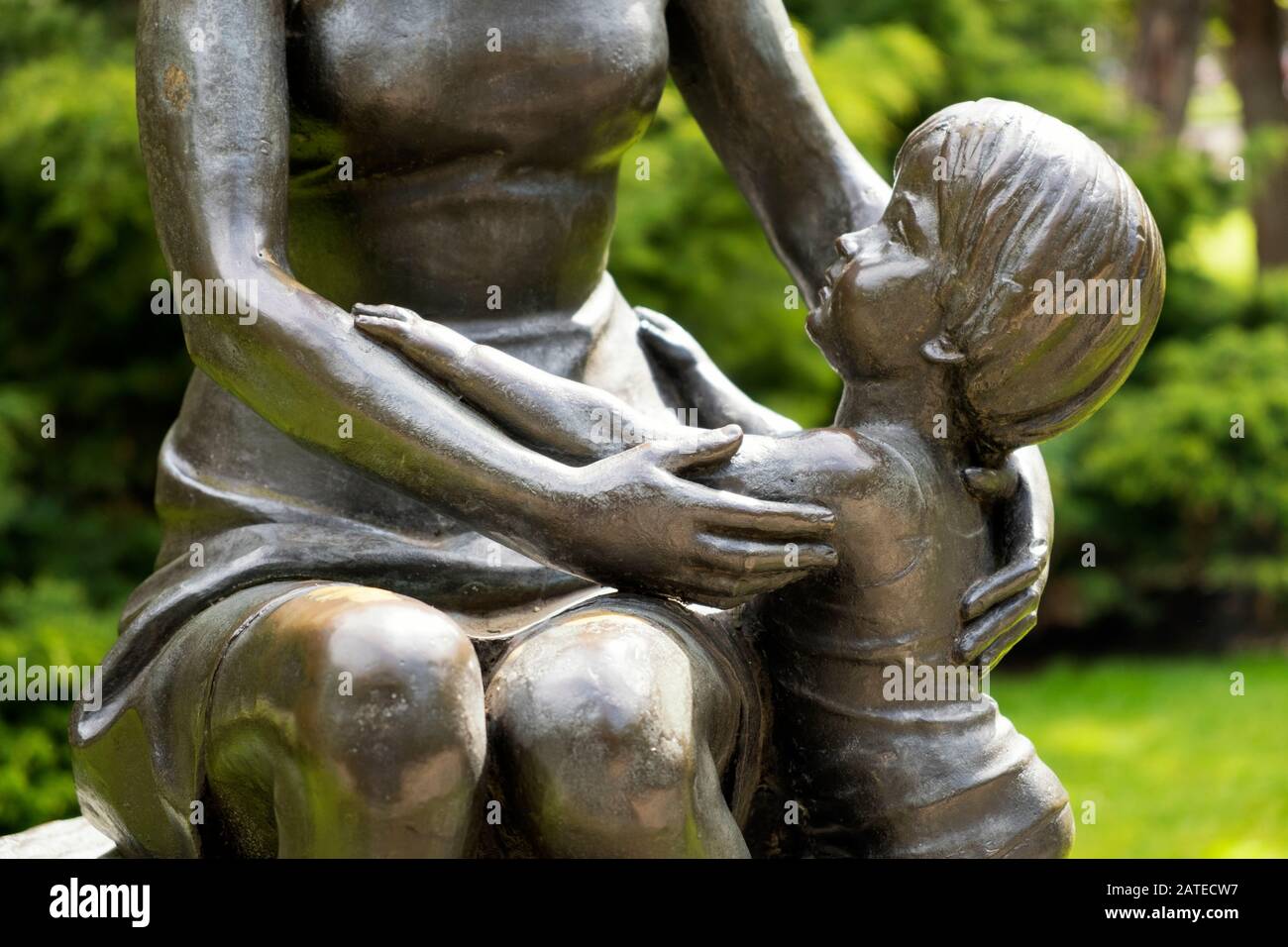 Closeup view of the bronze sculpture La Maternidad of the artist Félix Alonso Arena in Campo de San Francisco urban Park (Oviedo, Asturias, Spain) Stock Photo