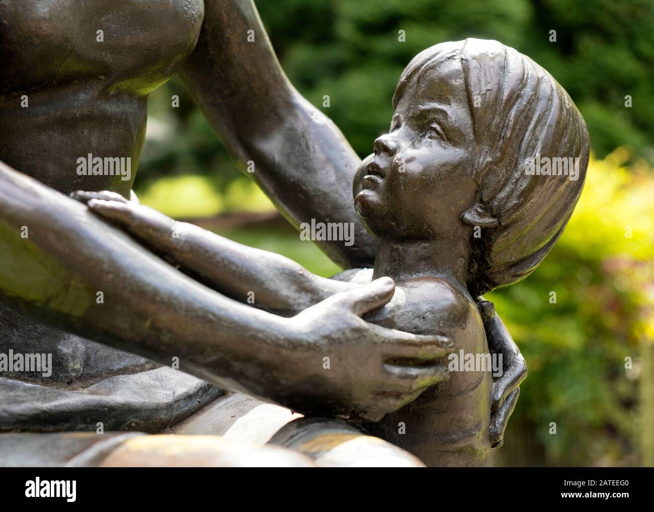 Closeup view of the bronze sculpture La Maternidad of the artist Félix Alonso Arena in Campo de San Francisco urban Park (Oviedo, Asturias, Spain) Stock Photo