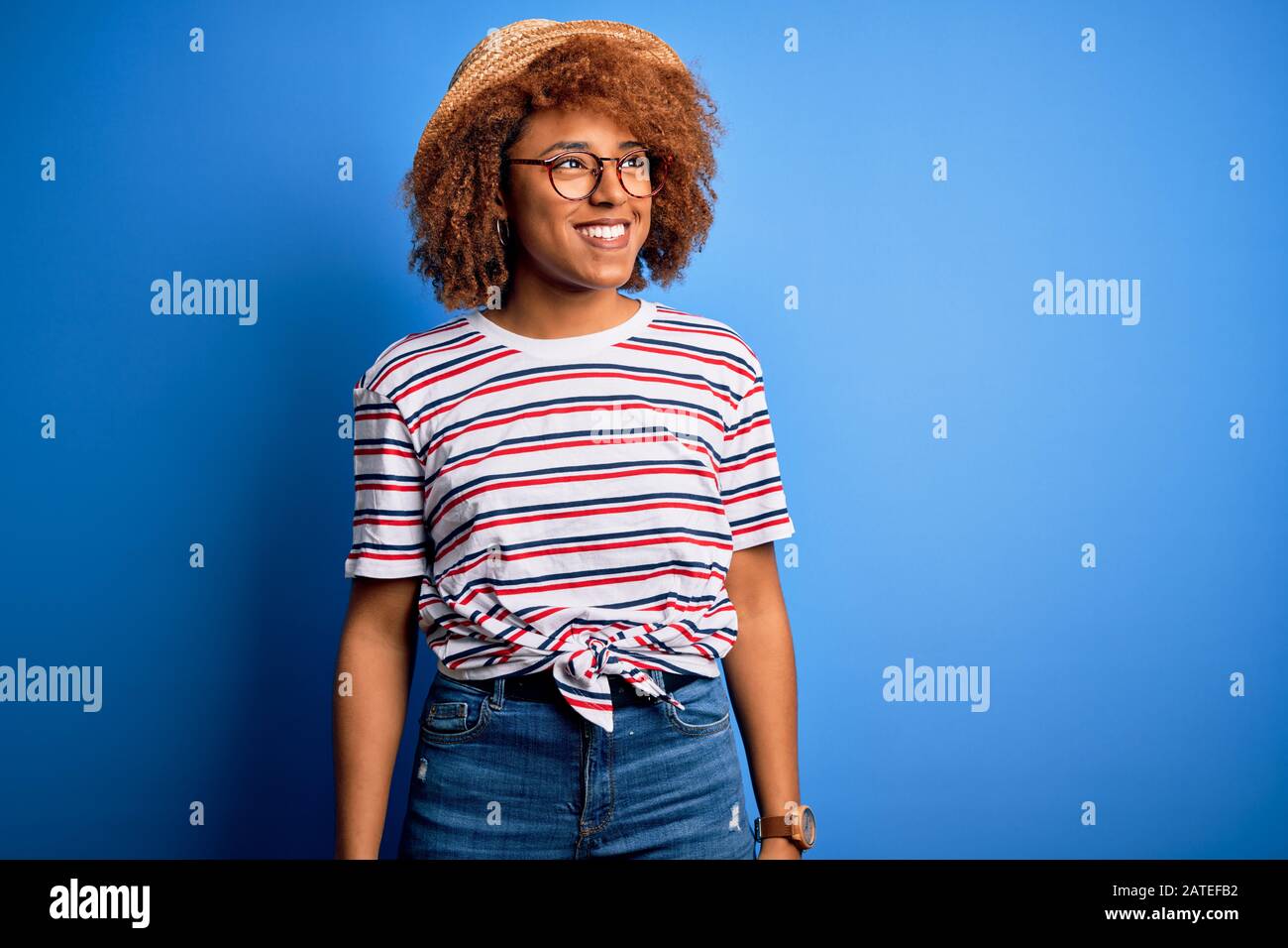 African American Woman With Curly Hair On Vacation Wearing Summer