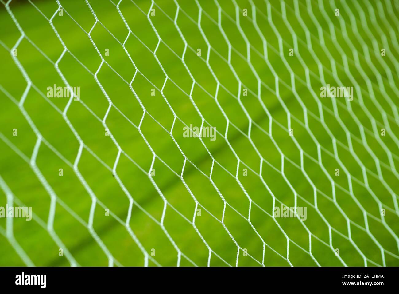 Soccer goal net on grass field Stock Photo