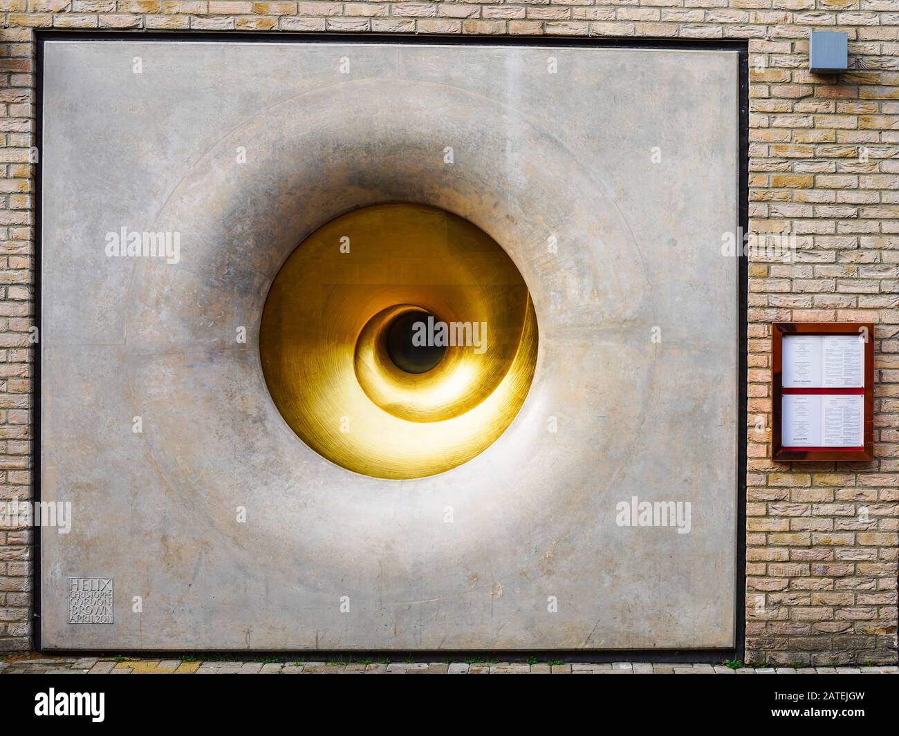 Helix Sculpture by Christophe Gordon-Brown at the entrance to the  Varsity Hotel Cambridge. Gold leaf spiral in polished concrete wall. April 2011. Stock Photo