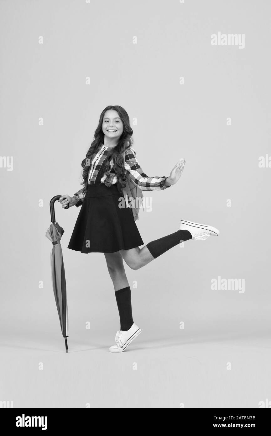 Be Happy And Go To School Small Child Back To School In Autumn Little Girl Carry Stick Umbrella And Backpack To School School Is Open In Rainy Weather Education Stock Photo