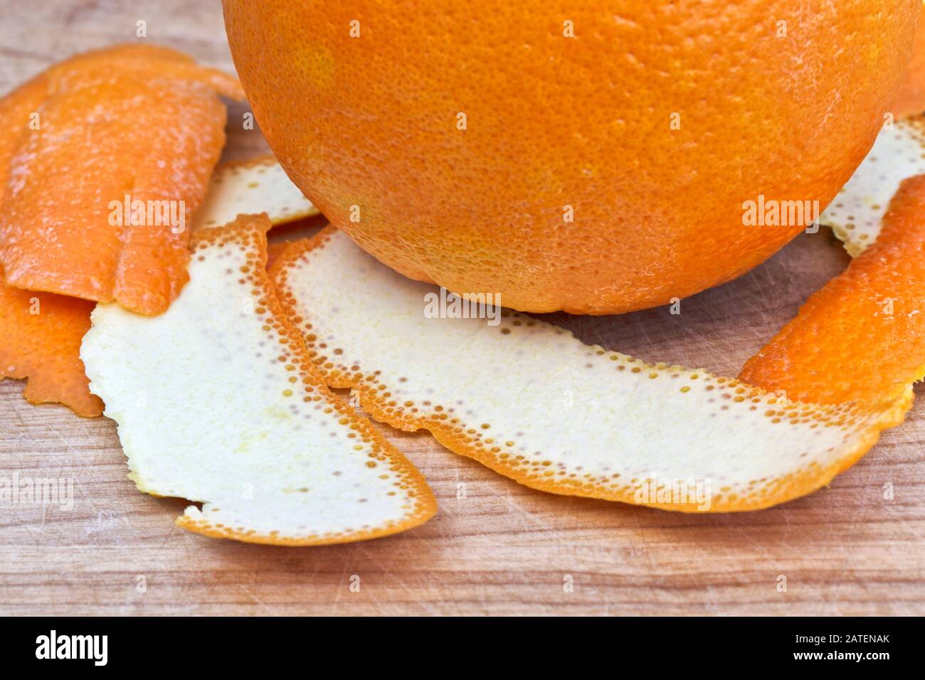 Ripe Navel Orange & peels  'Citrus sinensis' on cutting board,  California. Stock Photo