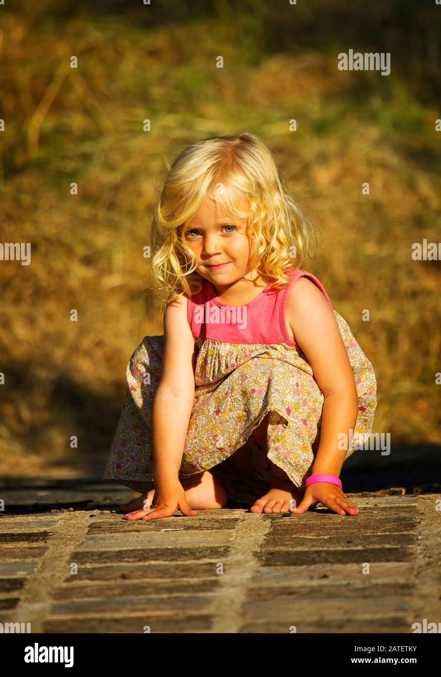 Child portrait of a sweet little blonde girl Stock Photo