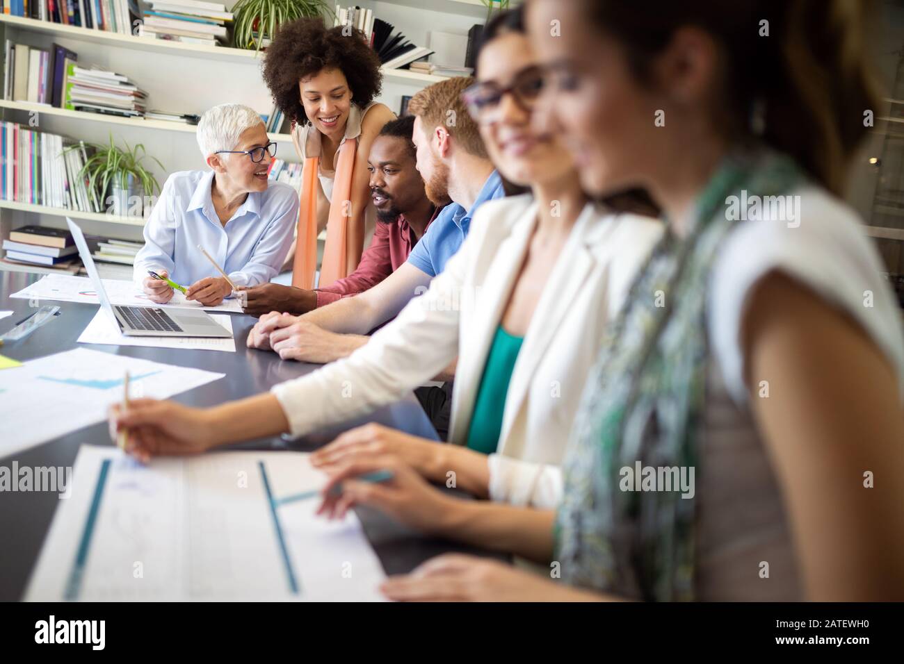 Successful group of business people at work in office Stock Photo - Alamy