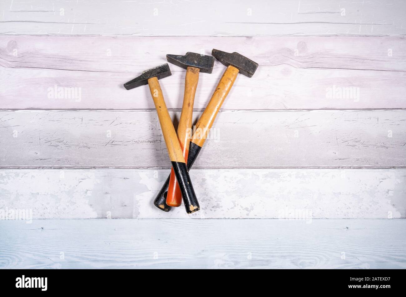 set of different types of hammers on a wooden background. top view Stock Photo Alamy