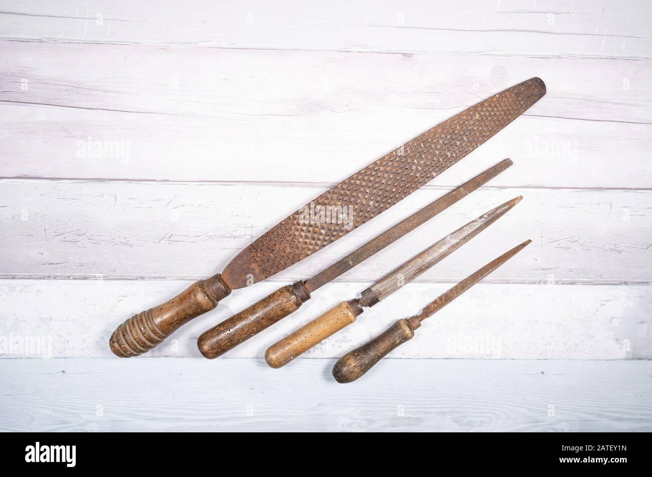 Sets of different wood rasps of different sizes in the middle of an old ...