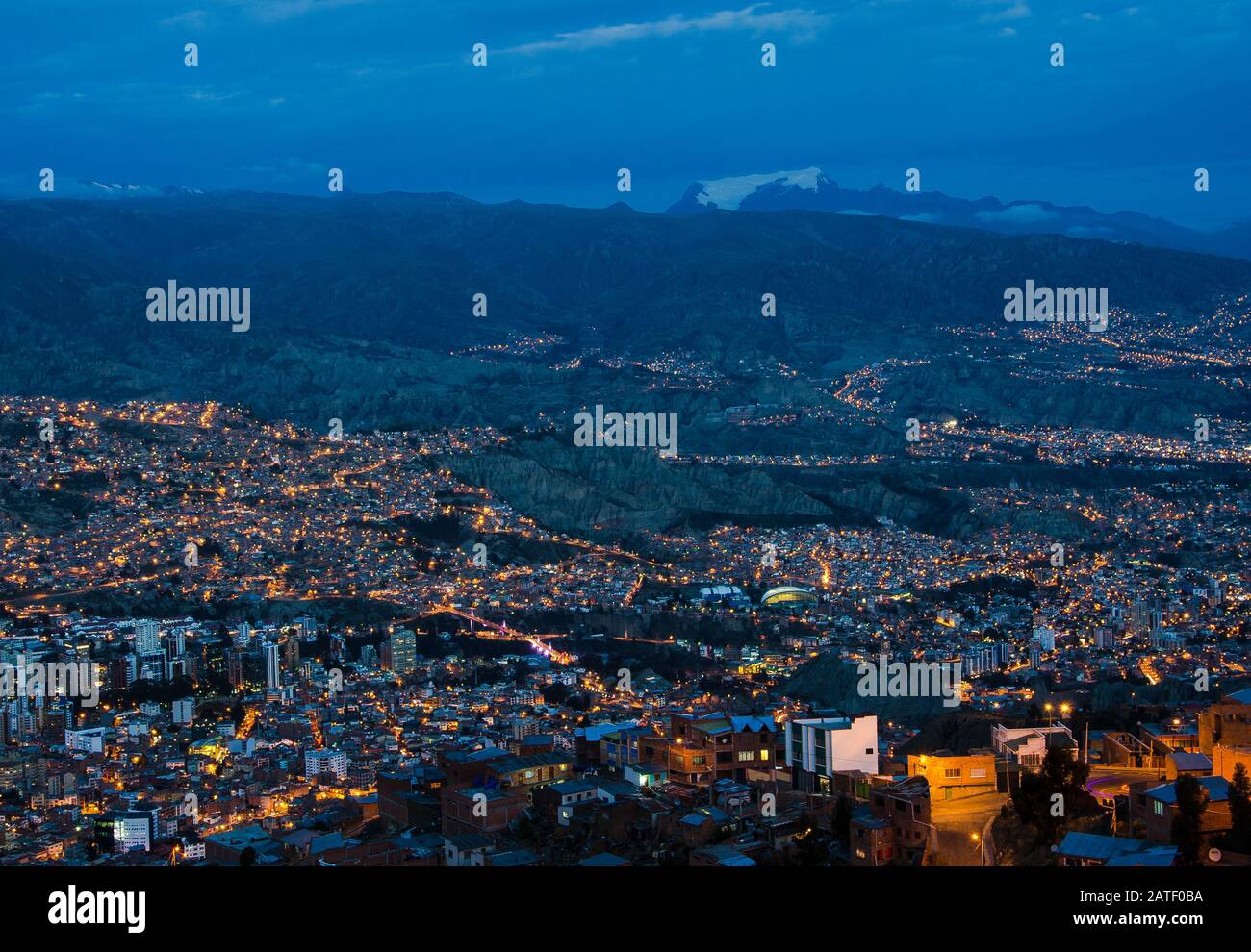 View over the city center of La Paz, Bolivia at night. On the left side the Metropolitan Cathedral on Murillo Square can be seen. Stock Photo