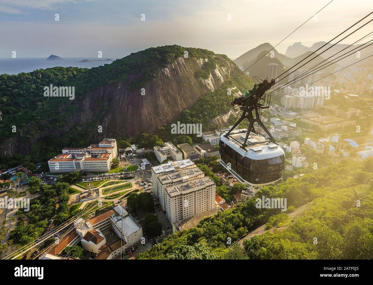 View of a cable car at sunset, showing several beaches and landmarks in ...