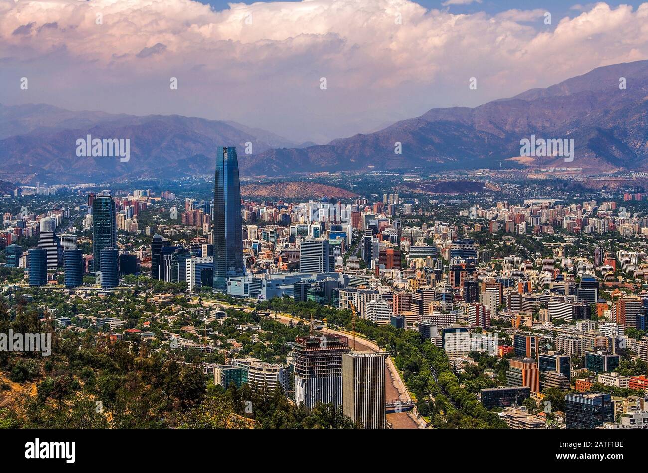 View of Santiago de Chile with Los Andes mountain range in the back at sunset time Stock Photo