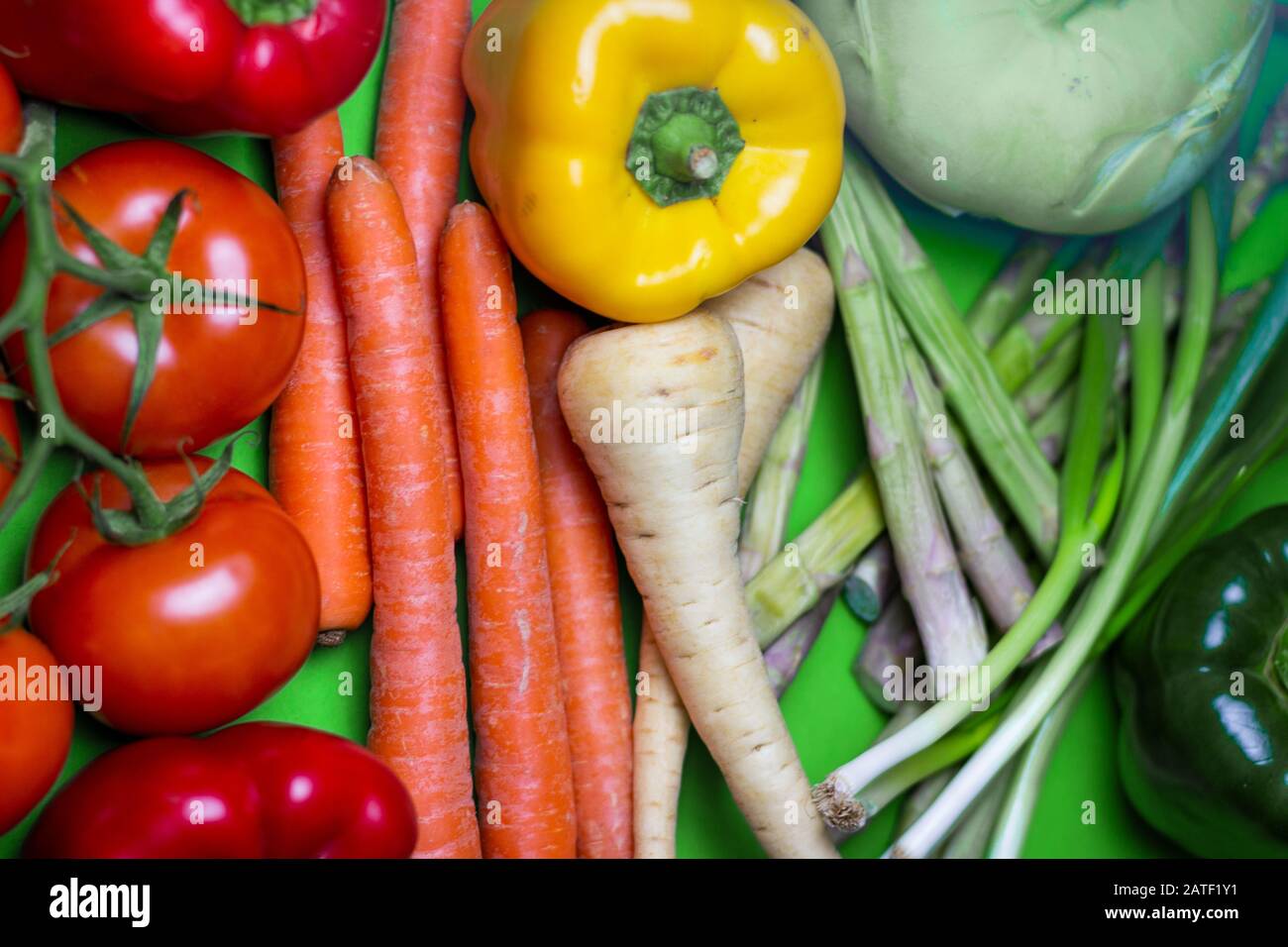 Colorful vegan Food spectrum Background. Organic and Fresh vegetables Concept. Food art rainbow. Stock Photo