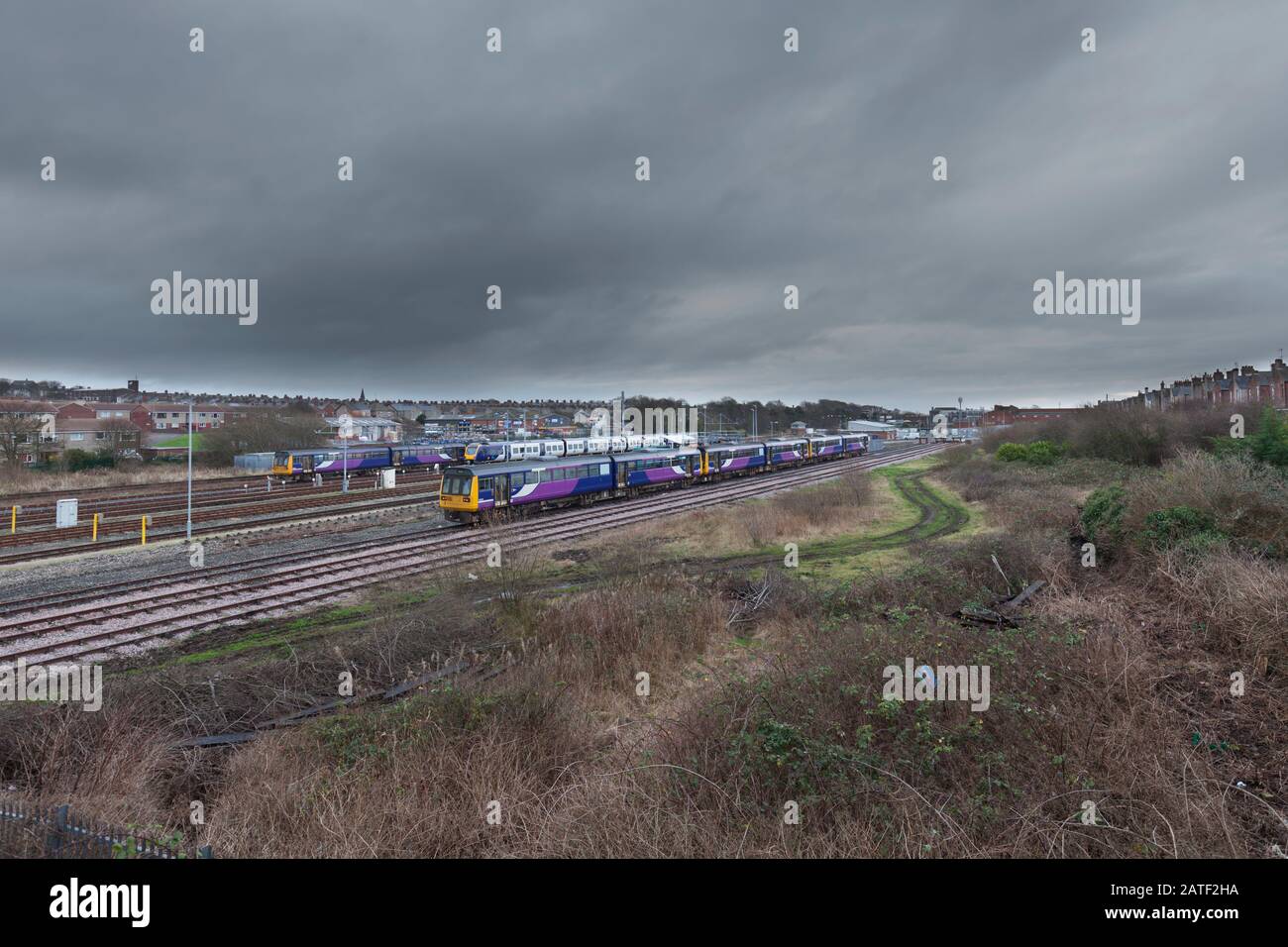 withdrawn Arriva Northern rail class 142 pacer trains stored at Barrow In Furness carriage sidings awaiting scrapping. Stock Photo
