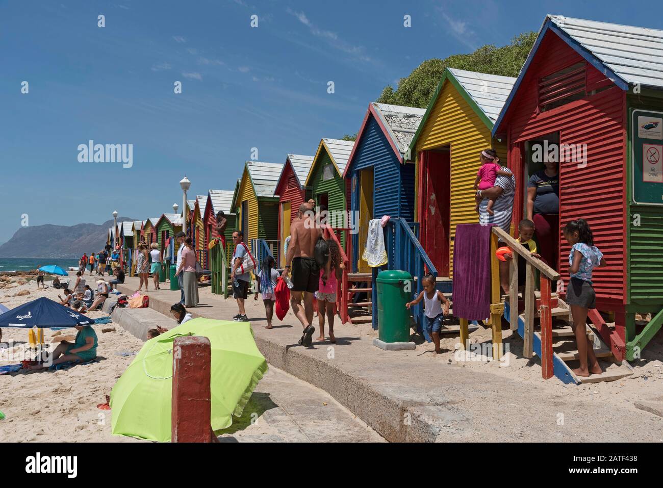 St James, Cape Town, South Africa. Dec 2019. The colourful beach huts and beach at St James